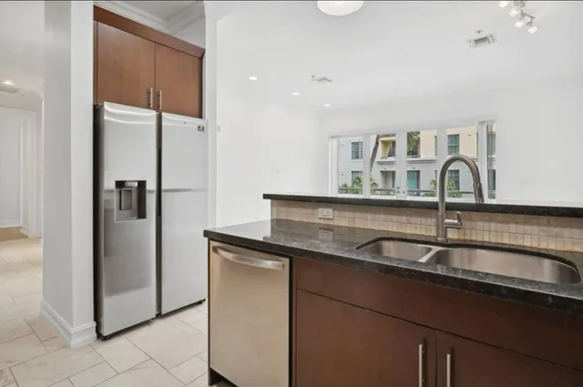 a view of an empty room with glass door