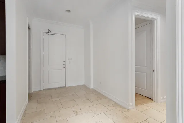 a view of an empty room and a window