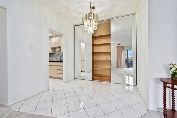 a kitchen with cabinets stainless steel appliances a sink and a stove