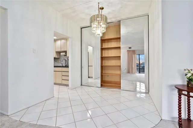 a kitchen with cabinets stainless steel appliances a sink and a stove