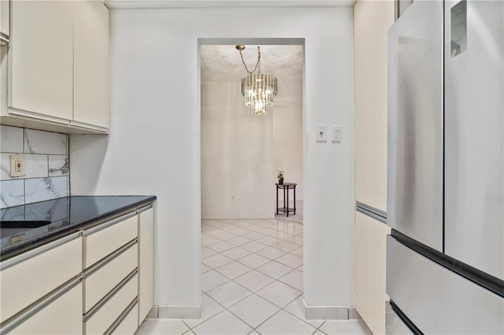 5600 Munhall Road, Unit 203 Pittsburgh, PA 15217 - Photo 14 of 31 a kitchen with white cabinets and sink