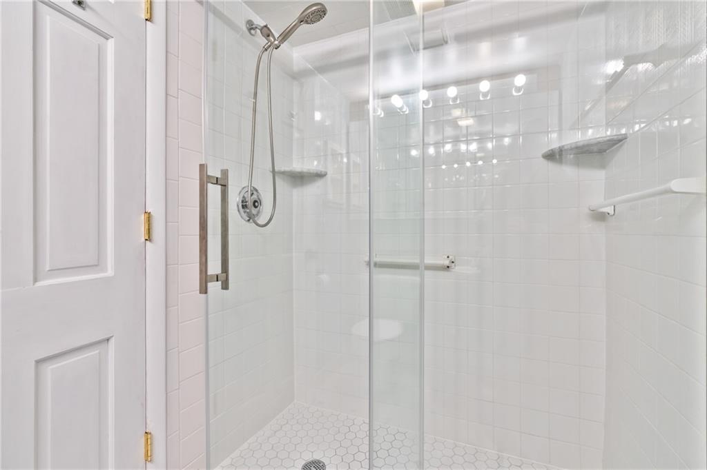 5600 Munhall Road, Unit 203 Pittsburgh, PA 15217 - Photo 19 of 31 a bathroom with a glass shower door