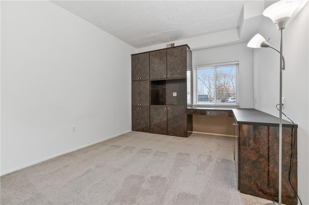5600 Munhall Road, Unit 203 Pittsburgh, PA 15217 - Photo 21 of 31 an empty room with wooden floor and windows