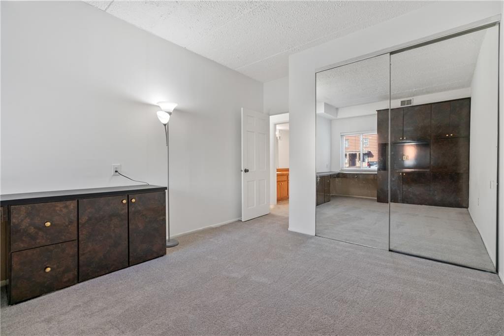 5600 Munhall Road, Unit 203 Pittsburgh, PA 15217 - Photo 22 of 31 a view of an empty room with a kitchen
