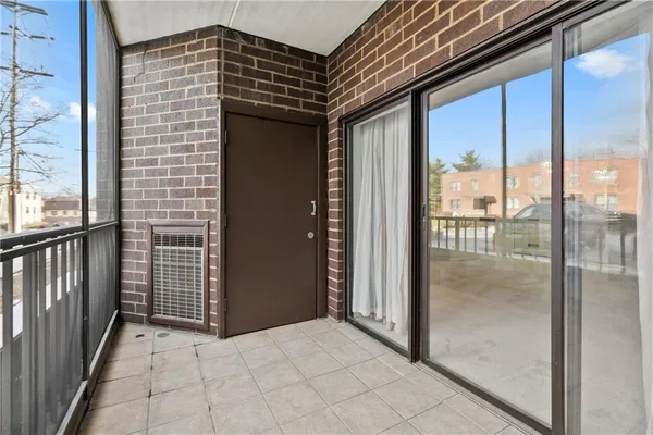 a kitchen with stainless steel appliances granite countertop a sink and white cabinets