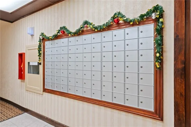 a living room with furniture a chandelier and a fireplace