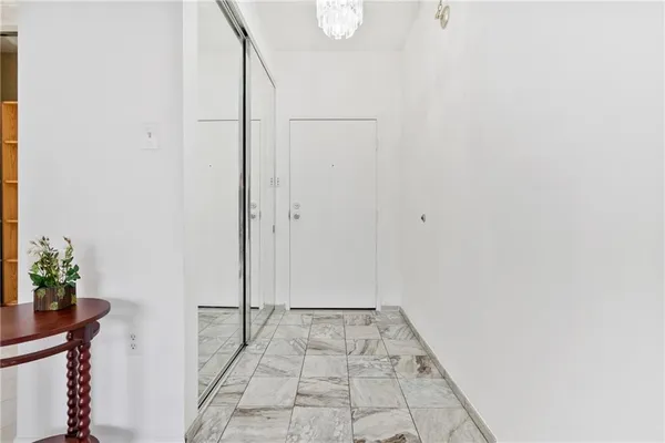 a view of an empty room with glass door