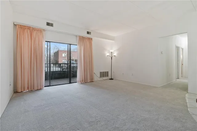 a view of empty room with closet area