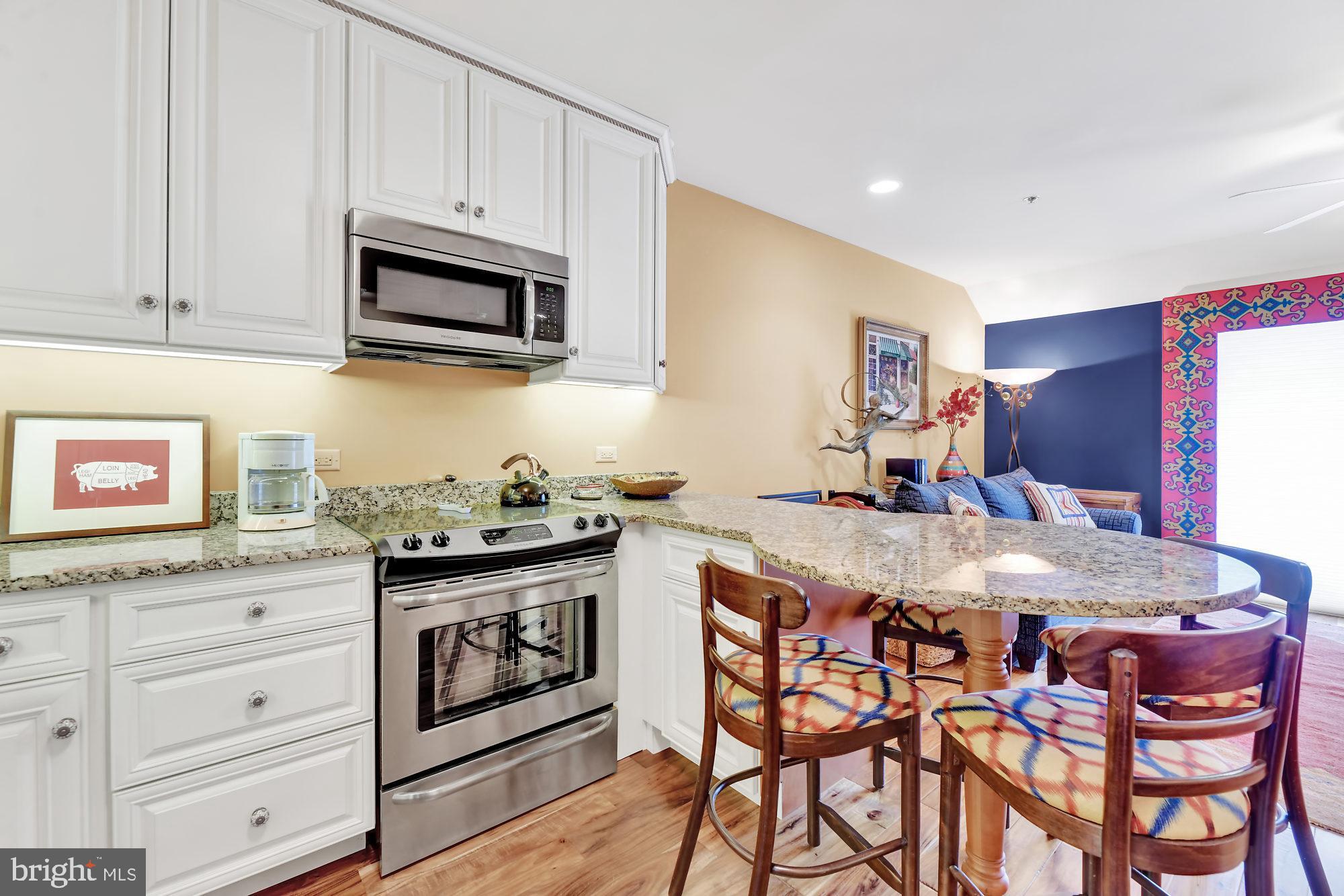 2331 Old Court Road, Unit 504 Baltimore, MD 21208 - Photo 14 of 37 Granite counters and clean cabinetry
