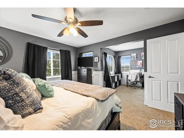 a bedroom with furniture and a window