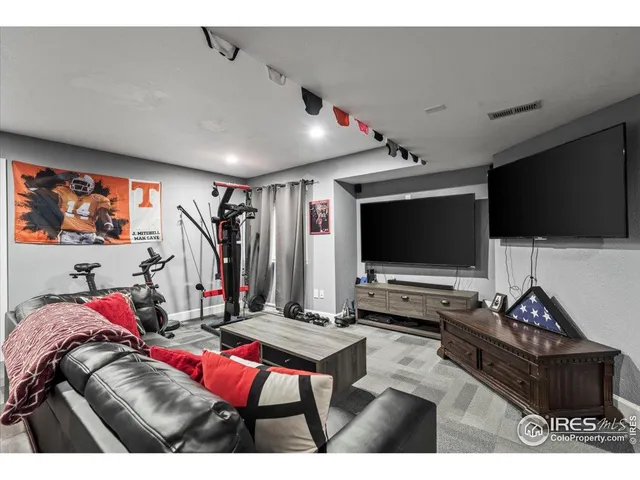 a living room with lots of furniture and a flat screen tv