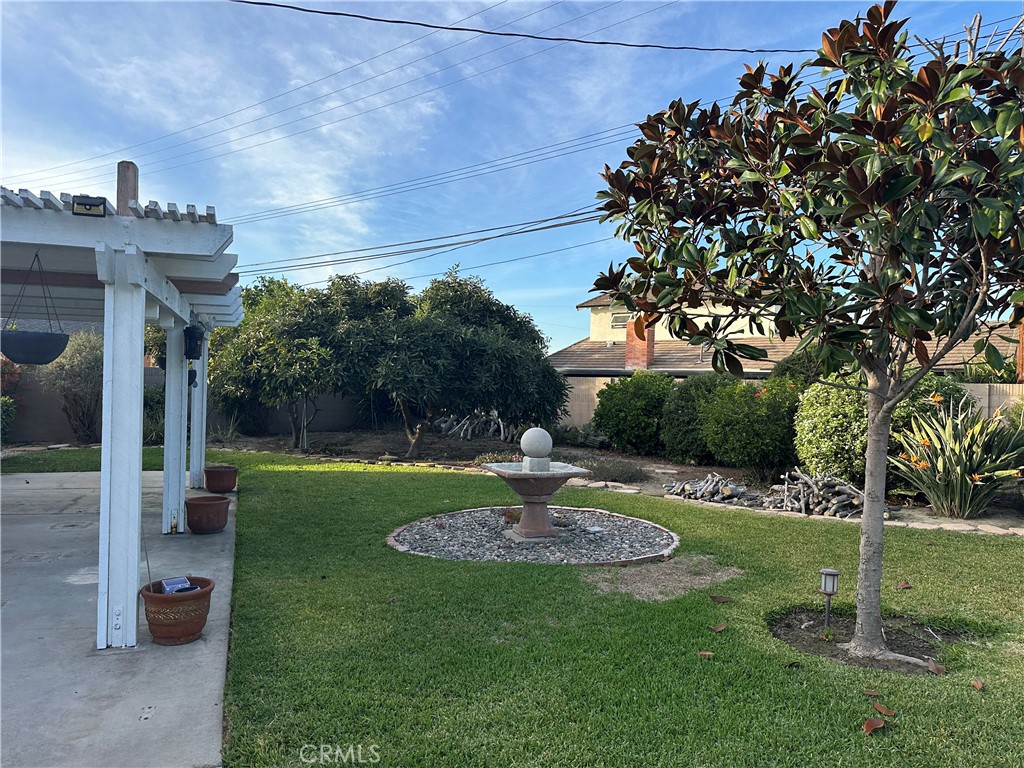 16768 Buckeye Circle Fountain Valley, CA 92708 - Photo 15 of 17 a view of a garden with a fountain