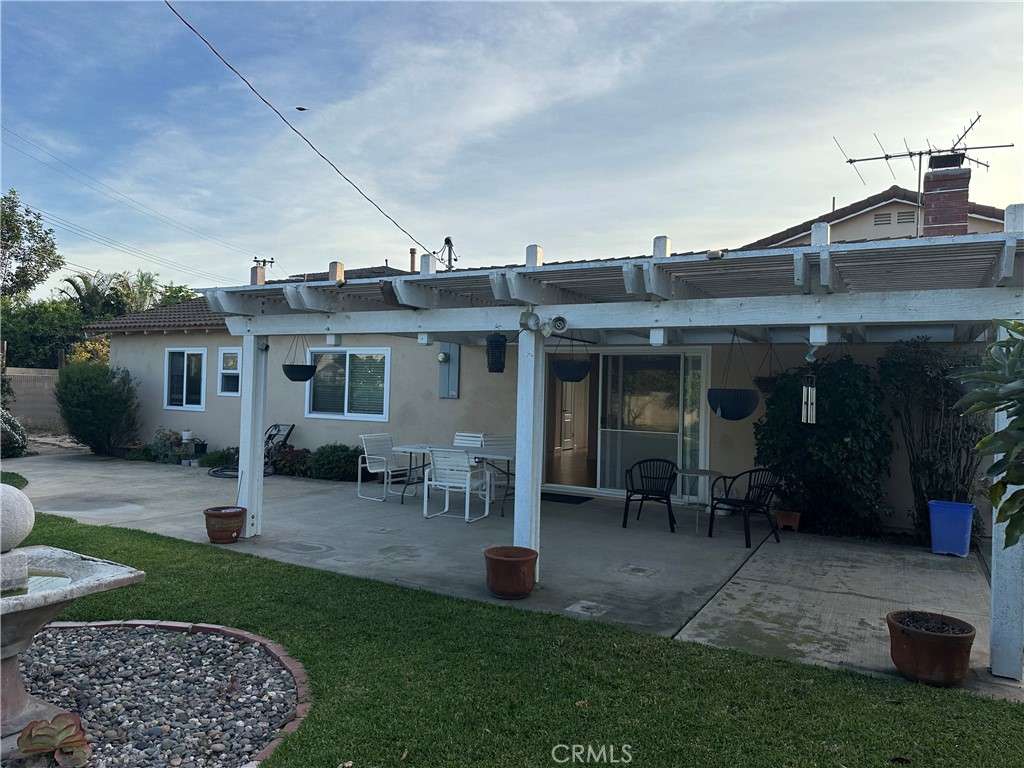 16768 Buckeye Circle Fountain Valley, CA 92708 - Photo 17 of 17 a view of a house with furniture and garden