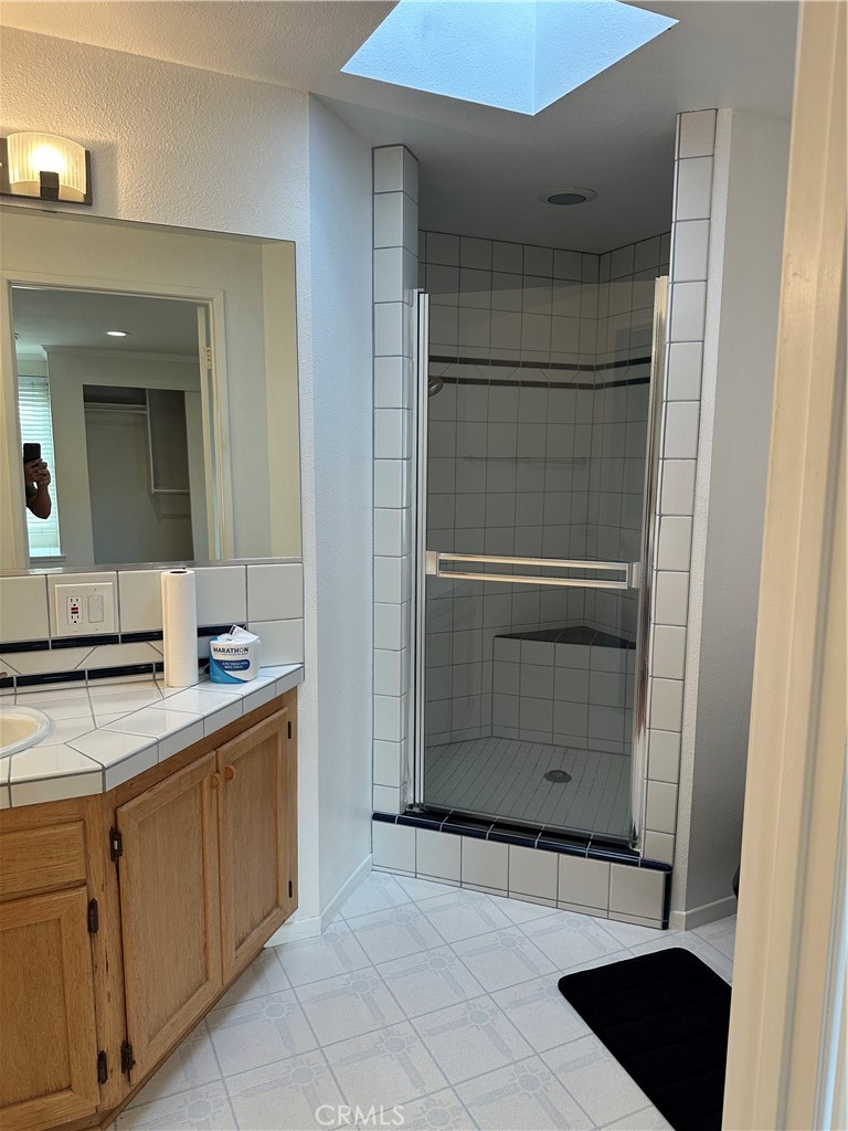 16768 Buckeye Circle Fountain Valley, CA 92708 - Photo 9 of 17 a bathroom with a shower and a sink