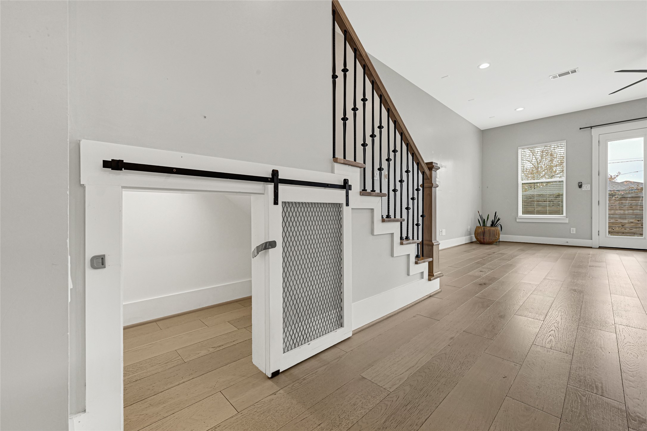4506 Hardy Street, Unit A Houston, TX 77009 - Photo 15 of 35 a view of a hallway with wooden floor and staircase