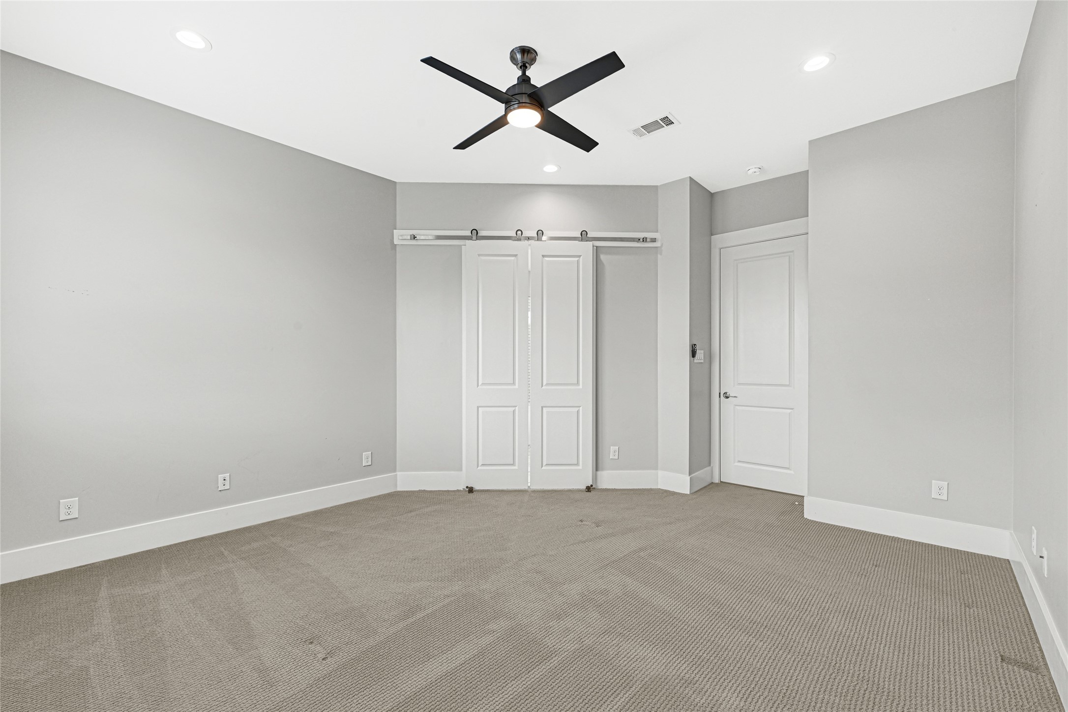 4506 Hardy Street, Unit A Houston, TX 77009 - Photo 19 of 35 an empty room with chandelier fan