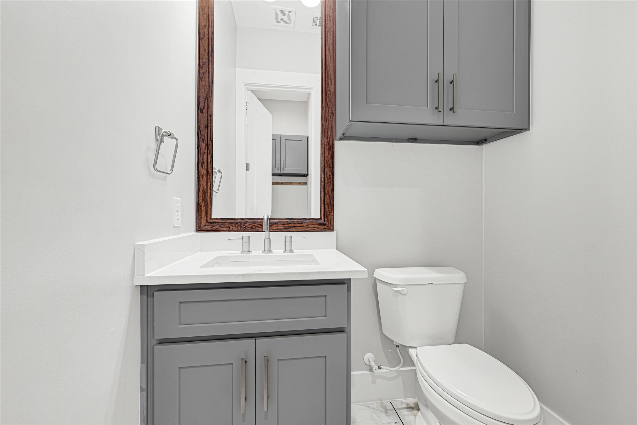 4506 Hardy Street, Unit A Houston, TX 77009 - Photo 35 of 35 a bathroom with a toilet a sink and mirror