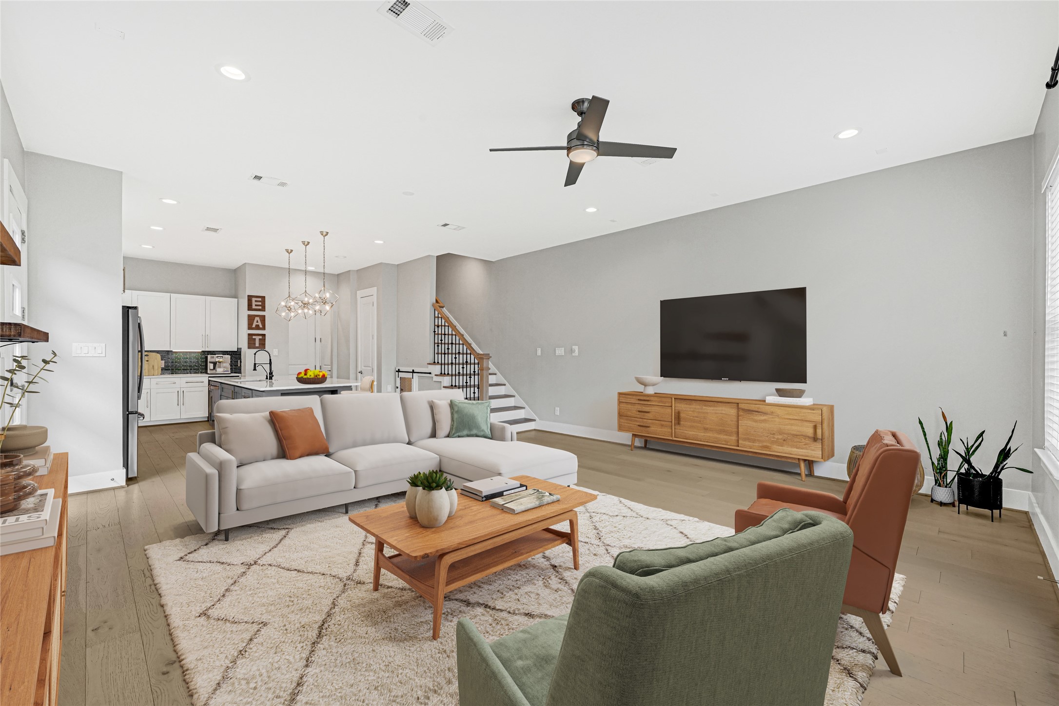 4506 Hardy Street, Unit A Houston, TX 77009 - Photo 5 of 35 a living room with furniture and a flat screen tv