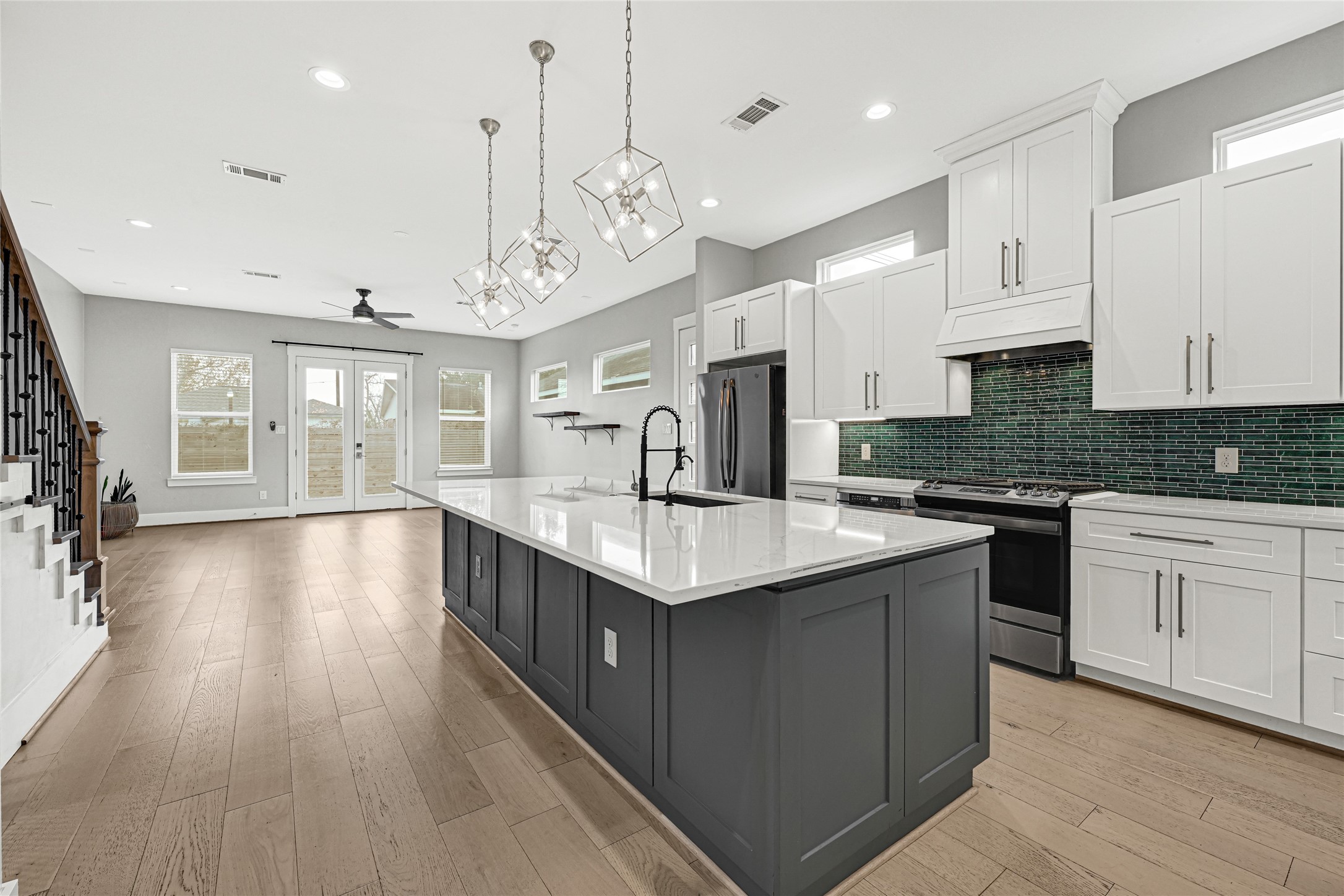 4506 Hardy Street, Unit A Houston, TX 77009 - Photo 6 of 35 a kitchen with stainless steel appliances granite countertop a stove and cabinets