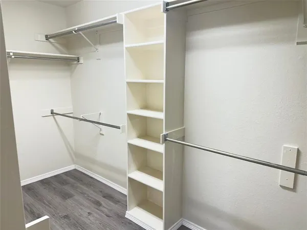 a view of an empty walk in closet