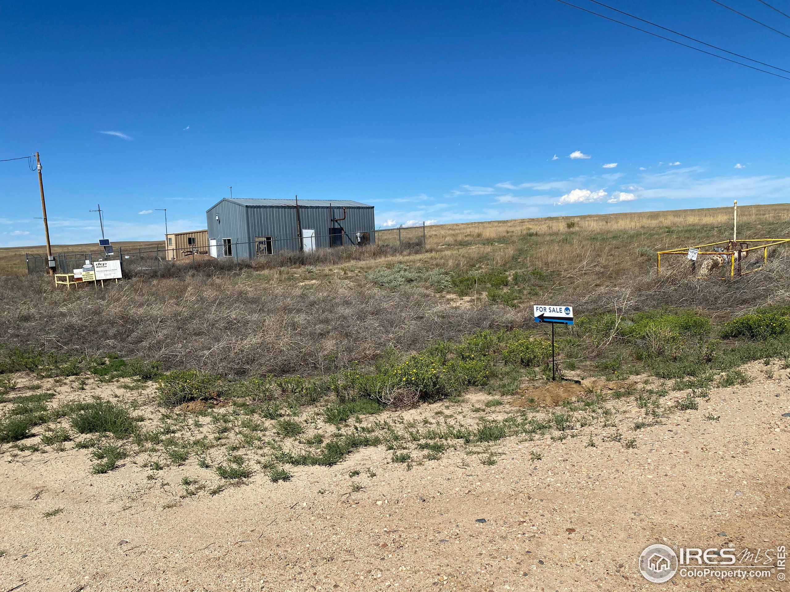 93 Weld County Rd Orchard, Unit TRACT 2 Orchard, CO 80649 - Photo 8 of 8 a view of a dry yard with wooden fence