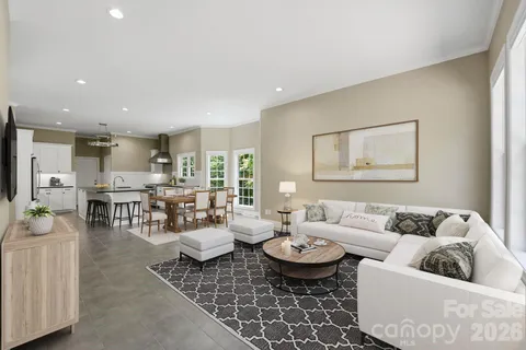 a living room with furniture and a table
