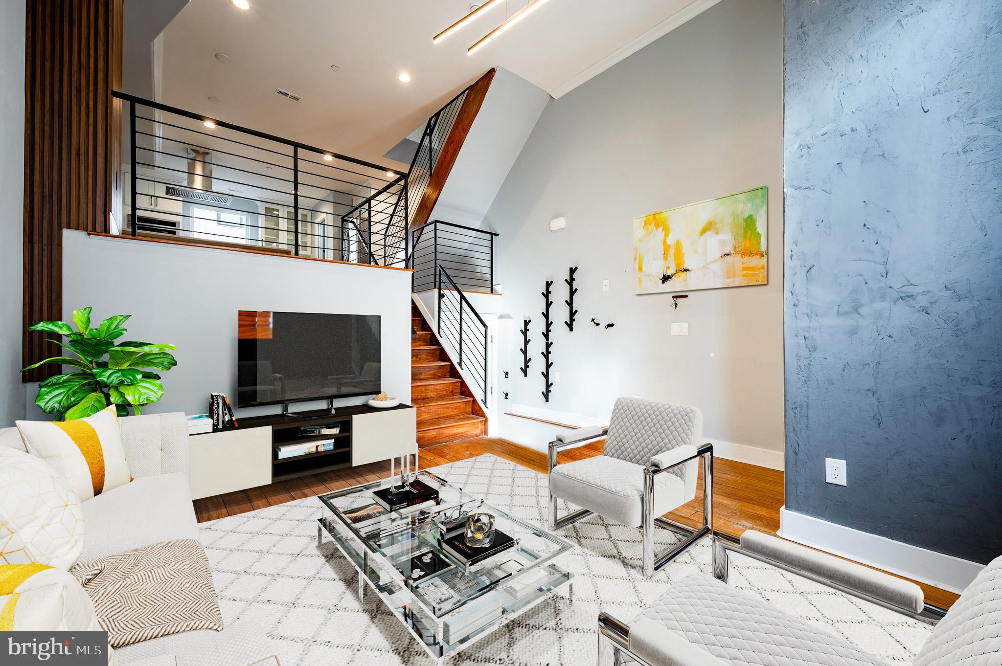 605 McClellan Street Philadelphia, PA 19148 - Photo 2 of 26 a living room with furniture and a flat screen tv