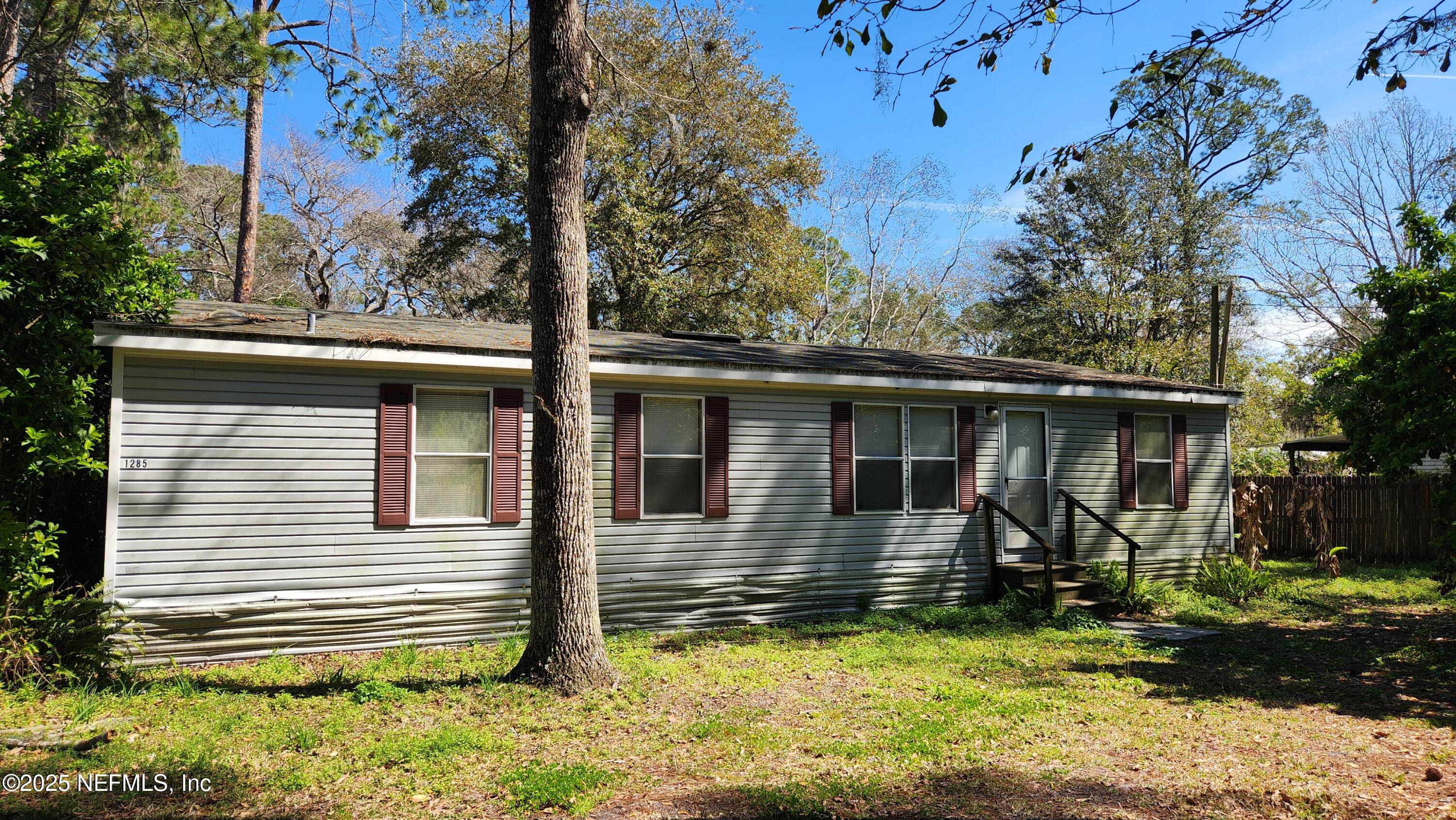 1285 Scott Road St. Johns, FL 32259 - Photo 3 of 20 front view of a house with a yard