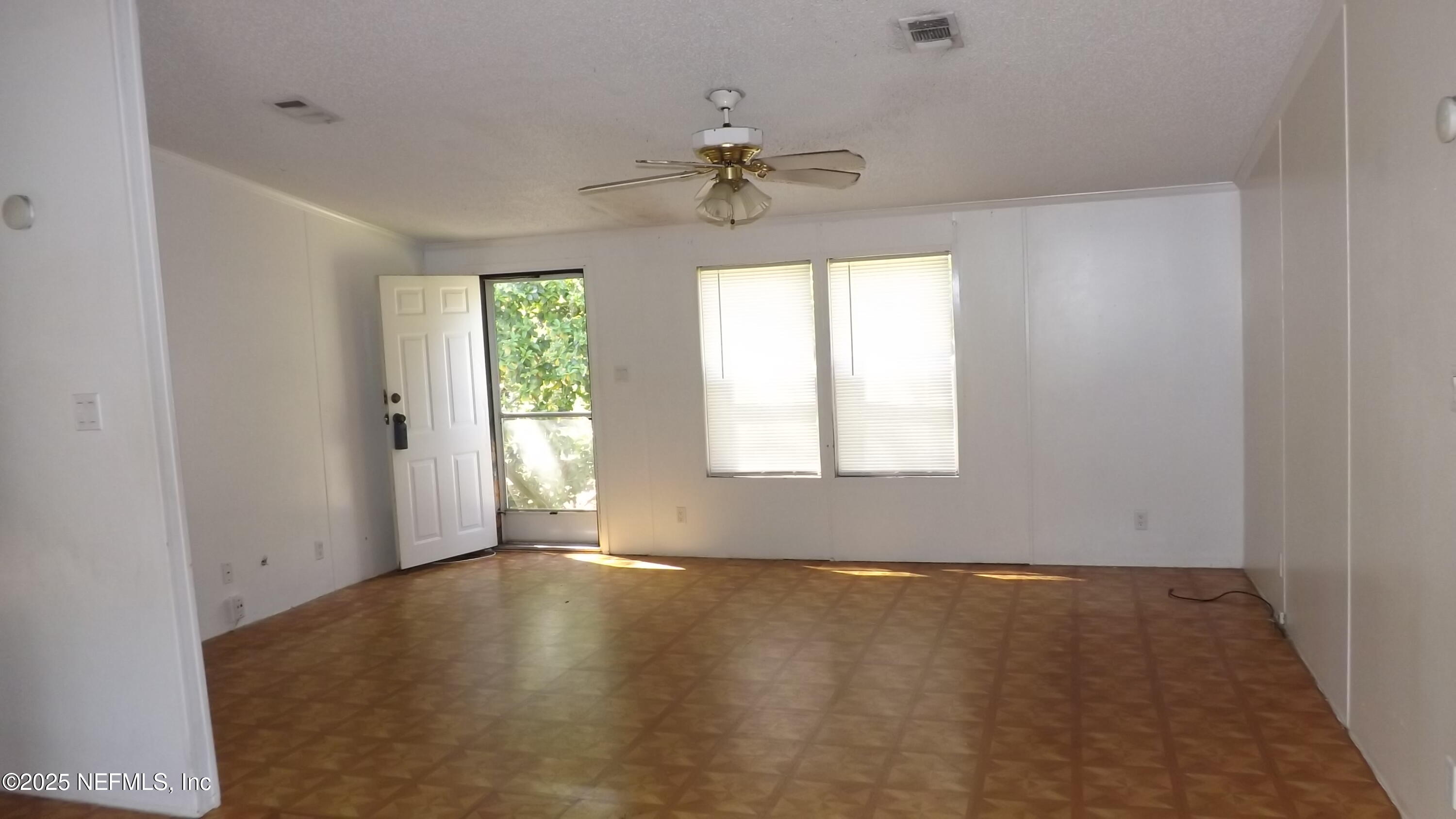 1285 Scott Road St. Johns, FL 32259 - Photo 7 of 20 wooden floor in an empty room with a window