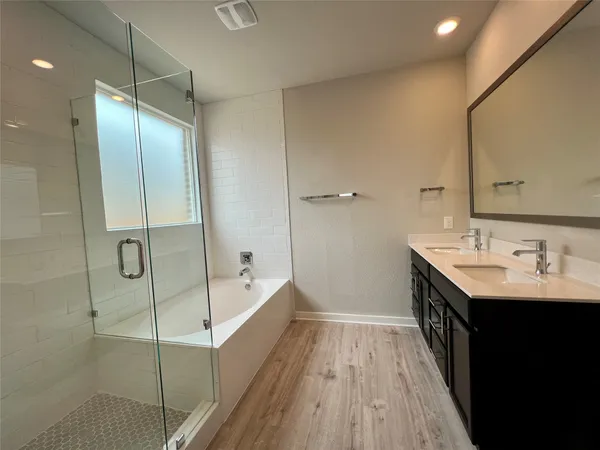 a bathroom with a double vanity sink and mirror