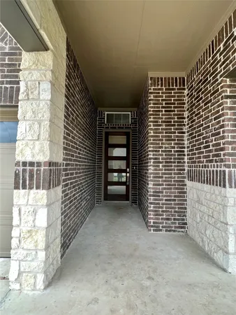 a view of livingroom with stairs and a window