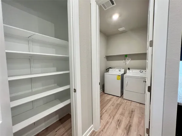 a storage room with washer and dryer