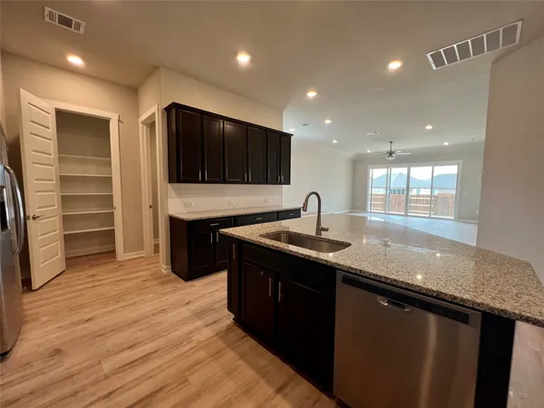 a kitchen with a sink and cabinets