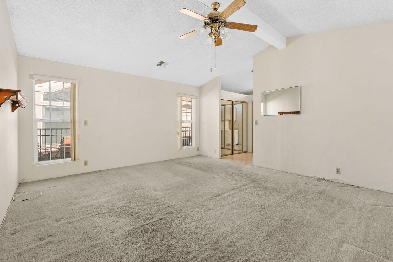 47857 Prado Way Indio, CA 92201 - Photo 18 of 36 a view of a livingroom with a ceiling fan and window