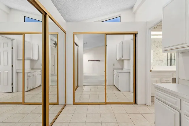 a bathroom with a shower and a sink