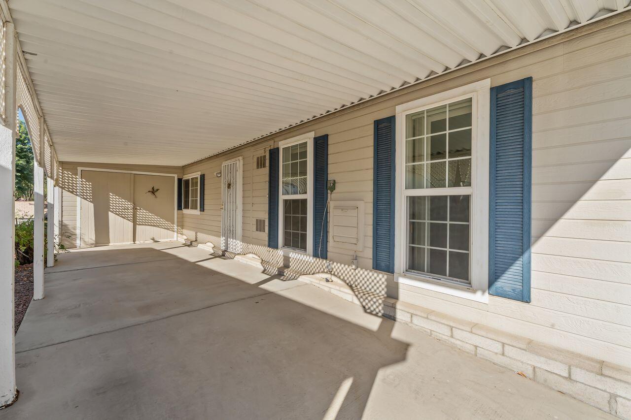 47857 Prado Way Indio, CA 92201 - Photo 26 of 36 a balcony with a bed and a large window