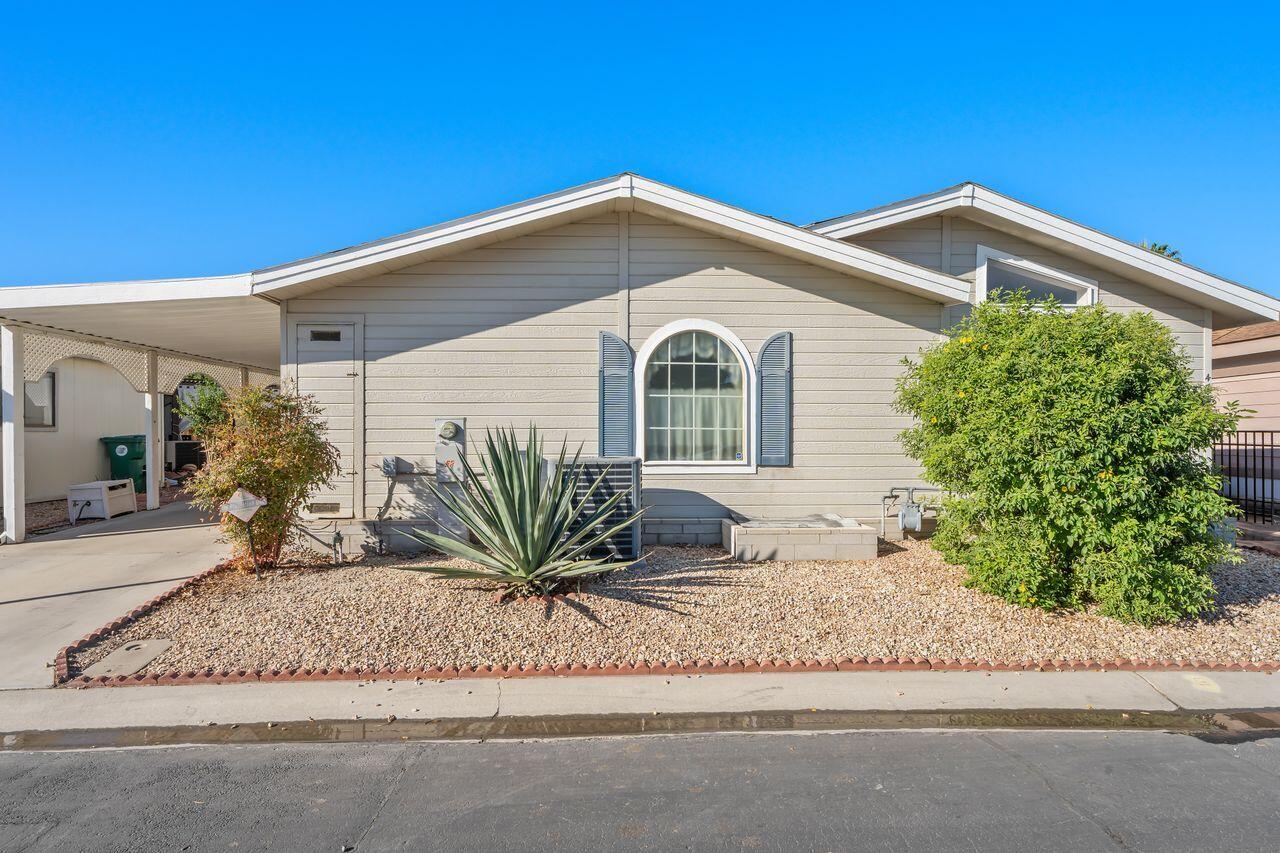 47857 Prado Way Indio, CA 92201 - Photo 28 of 36 a front view of a house with a yard