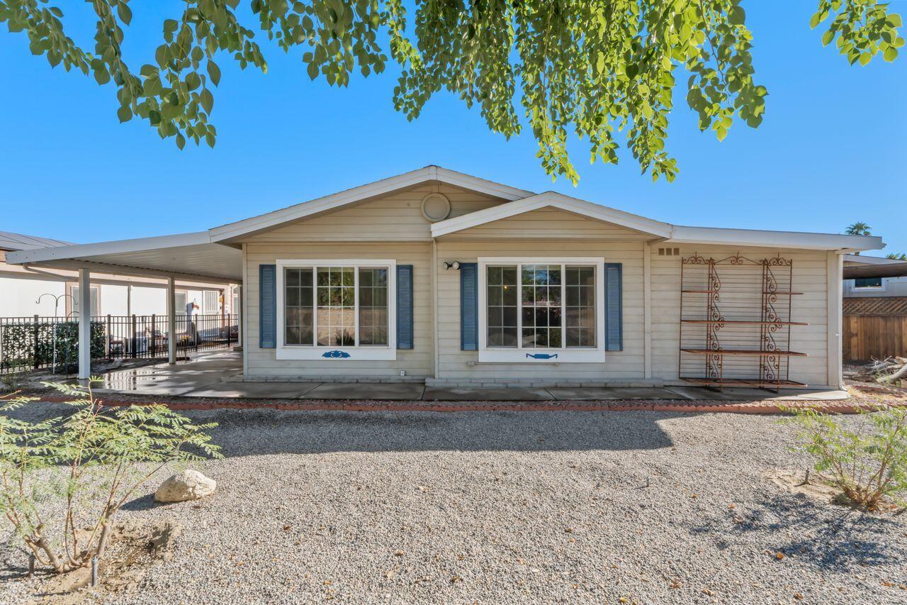 47857 Prado Way Indio, CA 92201 - Photo 3 of 36 a front view of a house with garden