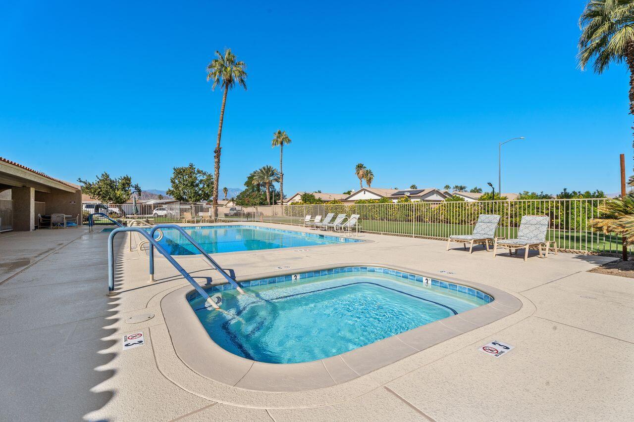 47857 Prado Way Indio, CA 92201 - Photo 35 of 36 a view of a swimming pool with a lounge chairs
