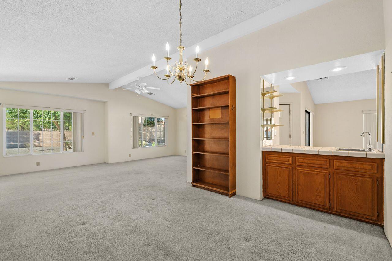 47857 Prado Way Indio, CA 92201 - Photo 9 of 36 a view of a kitchen with a sink and dishwasher a kitchen island