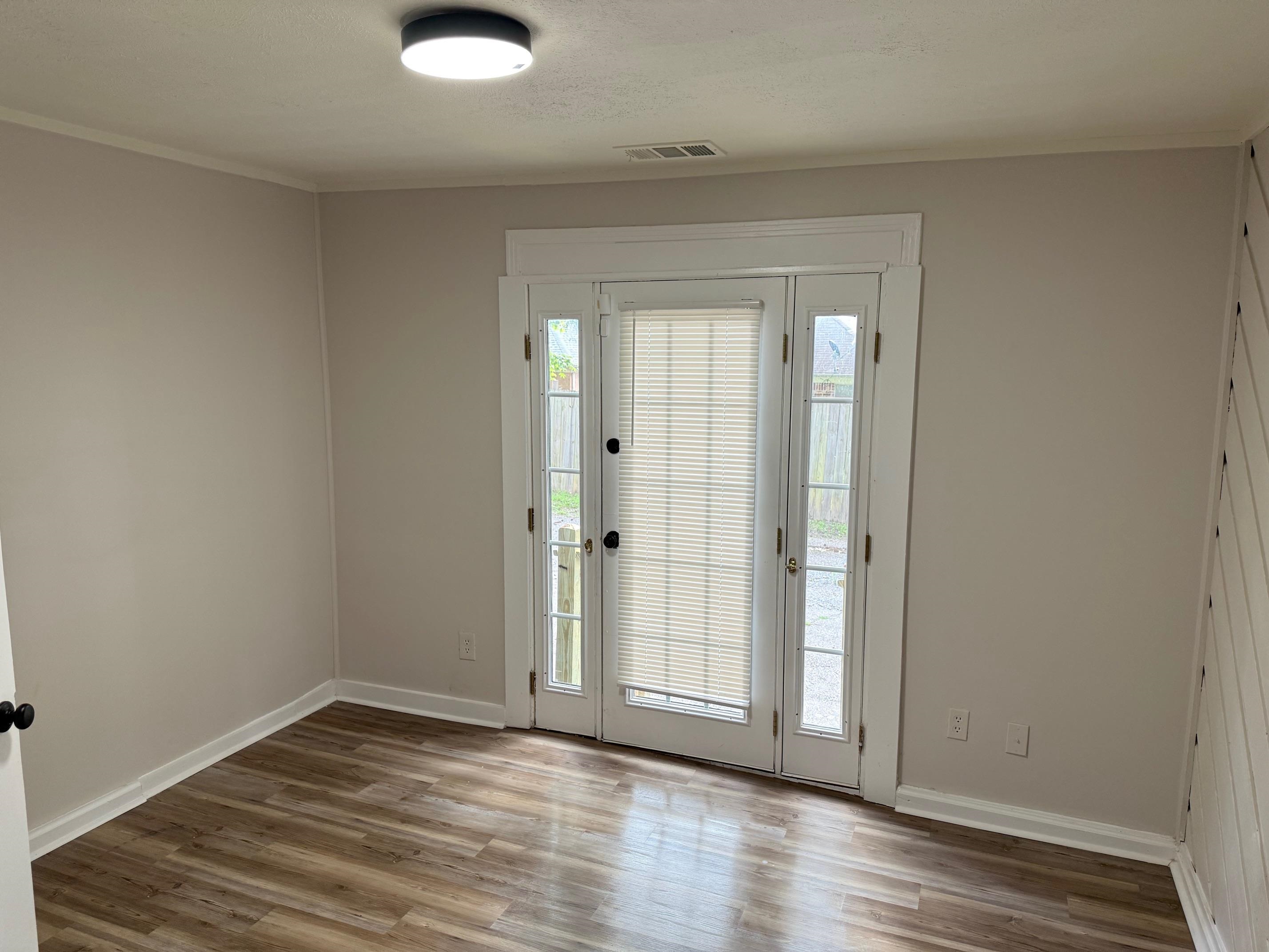 5657 Raleigh Lagrange Road Memphis, TN 38134 - Photo 3 of 8 Entryway with wood finished floors, baseboards, and crown molding