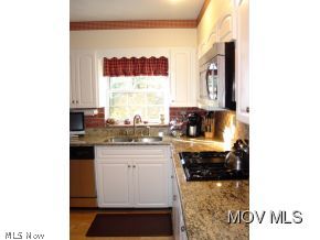 2209 New England Ridge Road Washington, WV 26181 - Photo 5 of 22 Kitchen has granite counters.