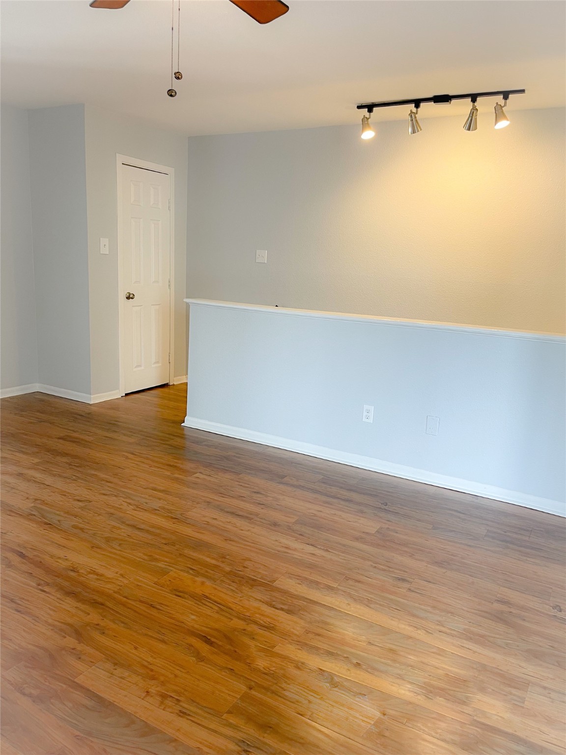 2744 Briarhurst Drive, Unit 50 Houston, TX 77057 - Photo 11 of 23 a view of an empty room with wooden floor and windows