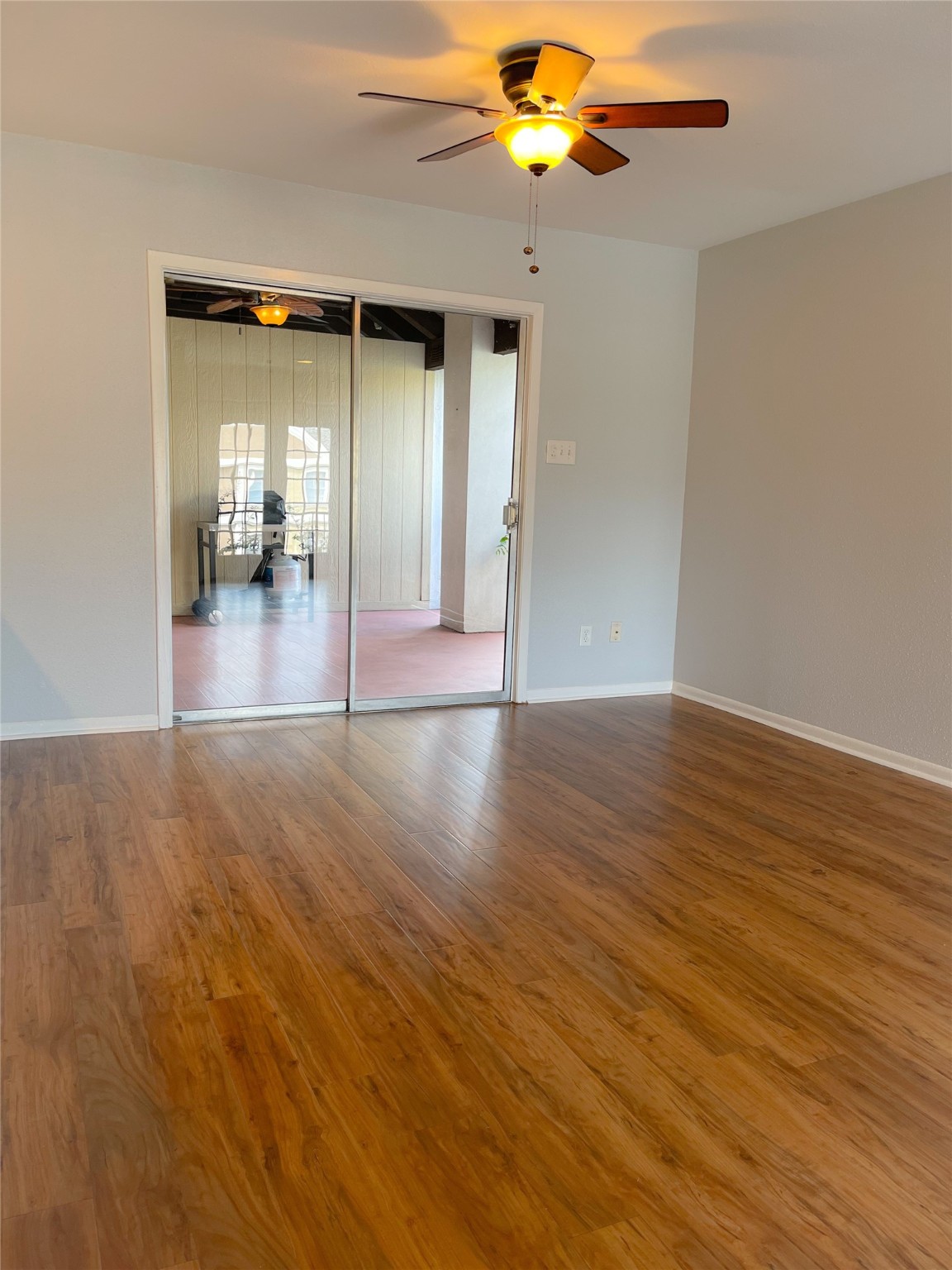 2744 Briarhurst Drive, Unit 50 Houston, TX 77057 - Photo 12 of 23 wooden floor in an empty room with a window