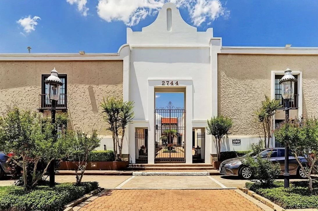 2744 Briarhurst Drive, Unit 50 Houston, TX 77057 - Photo 4 of 23 a front view of a house with tree s