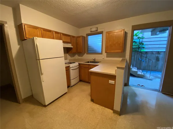 a utility room with refrigerator a washer and dryer