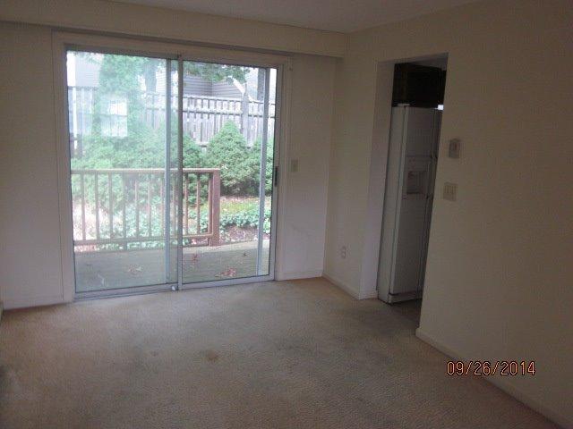 110 West Main Street, Unit 15 Hyannis, MA 02601 - Photo 2 of 10 a view of empty room with floor to ceiling window