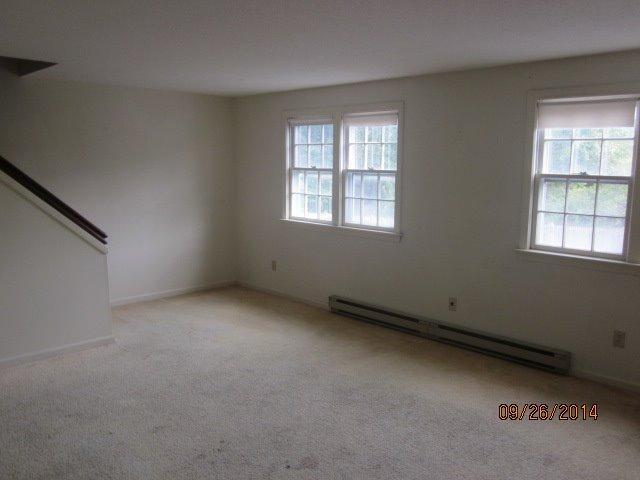 110 West Main Street, Unit 15 Hyannis, MA 02601 - Photo 9 of 10 an empty room with a window
