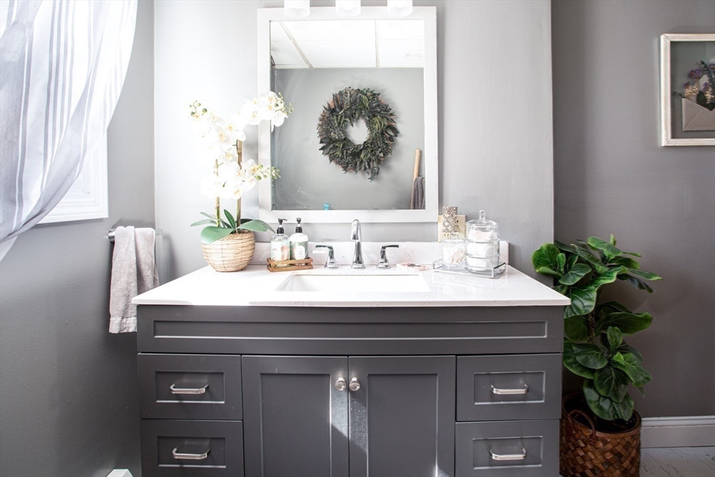 425 Pearce Street Fall River, MA 02720 - Photo 15 of 33 a room with a sink and a mirror