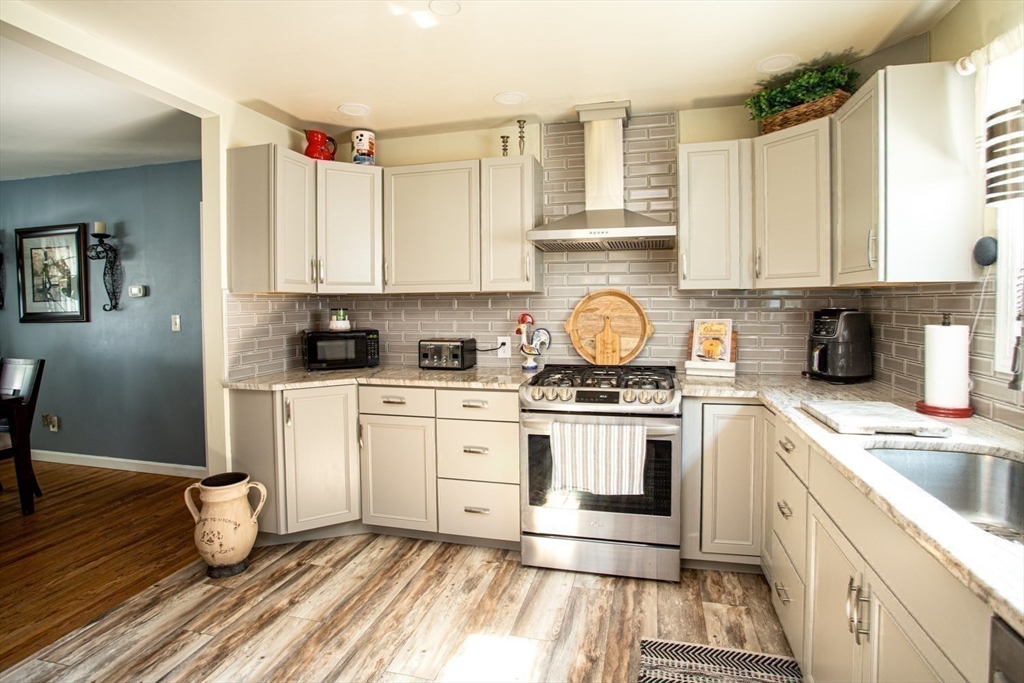 425 Pearce Street Fall River, MA 02720 - Photo 19 of 33 a kitchen with a sink cabinets appliances and a window